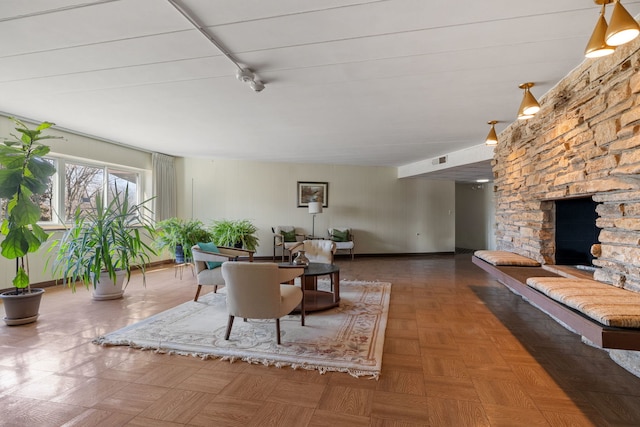 5540 Walnut Ave Unit 9A, Downers Grove, IL 60515 - living room featuring a stone fireplace and baseboards