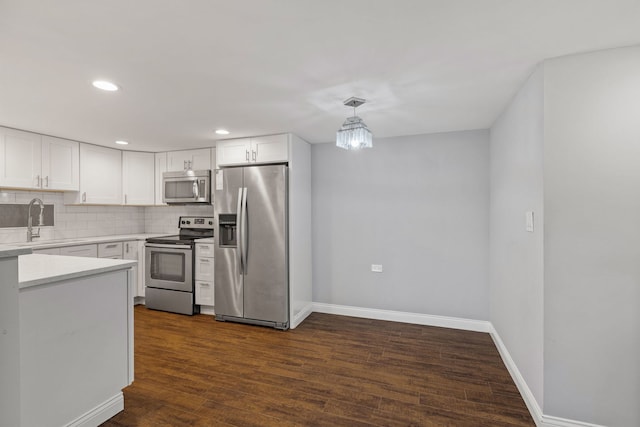 5540 Walnut Ave Unit 9A, Downers Grove, IL 60515 - kitchen featuring stainless steel appliances, recessed lighting, light countertops, white cabinetry, and decorative backsplash