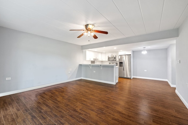 5540 Walnut Ave Unit 9A, Downers Grove, IL 60515 - unfurnished living room featuring ceiling fan and dark wood-style floors