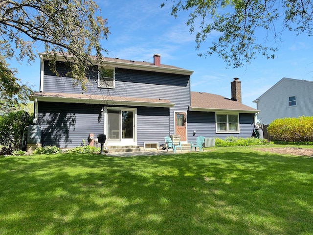 323 W Golf Rd, Libertyville, IL 60048 - back of house featuring a chimney, a yard, a patio area, and entry steps