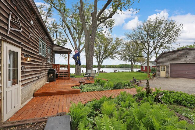 10317 195th Ave, Bristol, WI 53104 - wooden terrace featuring a water view, a grill, a lawn, and an outdoor structure