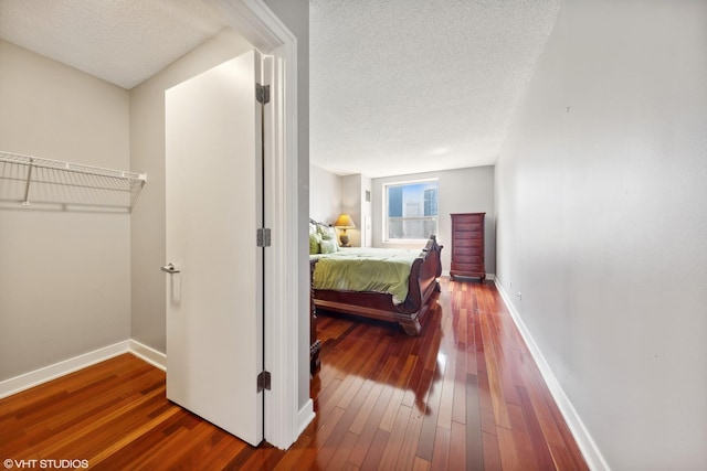 545 N Dearborn St Unit 3207, Chicago, IL 60654 - bedroom featuring a textured ceiling and wood-type flooring