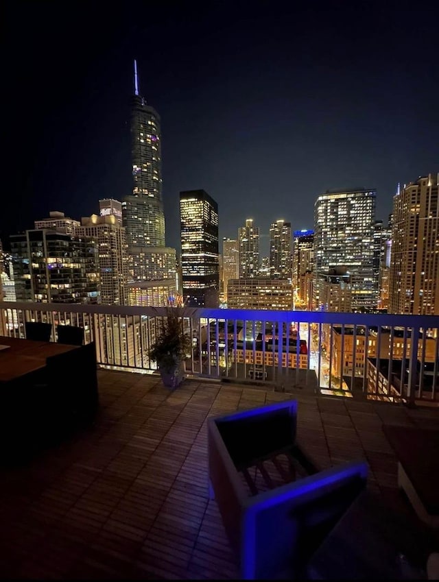 545 N Dearborn St Unit 3207, Chicago, IL 60654 - patio at night featuring a balcony and a view of city lights