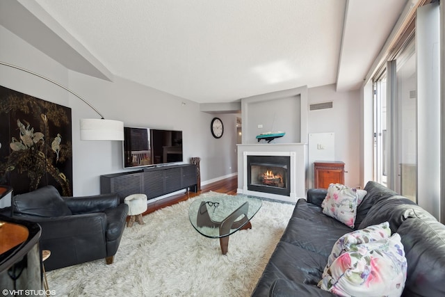 545 N Dearborn St Unit 3207, Chicago, IL 60654 - living area featuring wood finished floors and a warm lit fireplace