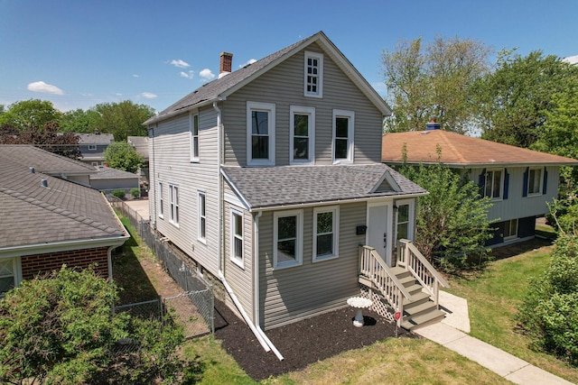 126 E Ave, La Grange, IL 60525 - view of front of property featuring a shingled roof and a chimney