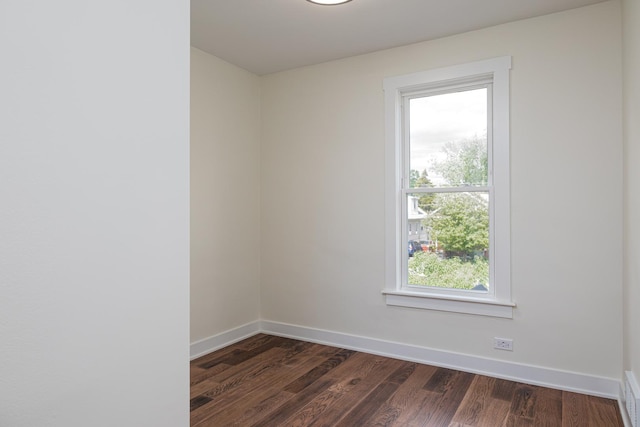 126 E Ave, La Grange, IL 60525 - empty room featuring dark wood-style flooring and baseboards