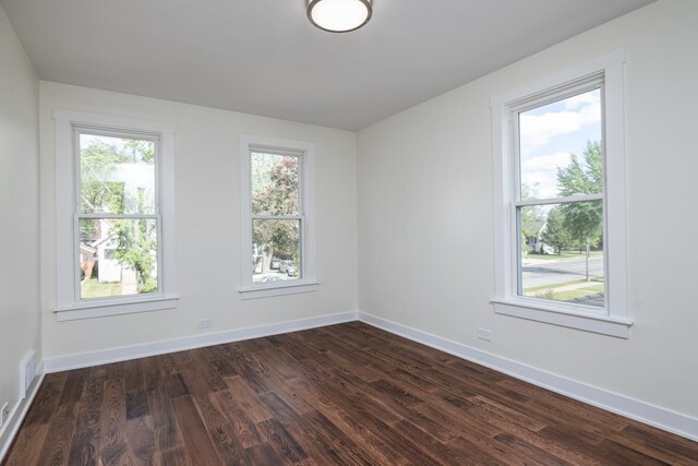 126 E Ave, La Grange, IL 60525 - empty room featuring dark wood-style flooring and baseboards