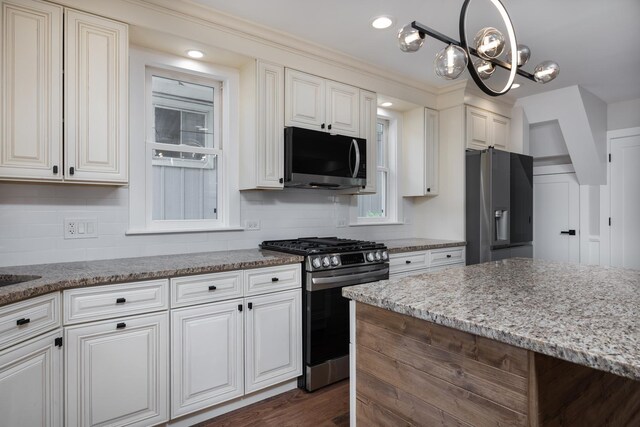 126 E Ave, La Grange, IL 60525 - kitchen featuring stainless steel appliances, white cabinetry, a chandelier, light stone countertops, and recessed lighting