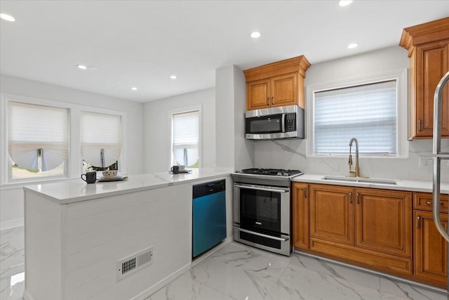 11456 S Talman Ave, Chicago, IL 60655 - kitchen featuring stainless steel appliances, light marble finish flooring, brown cabinets, recessed lighting, and decorative backsplash