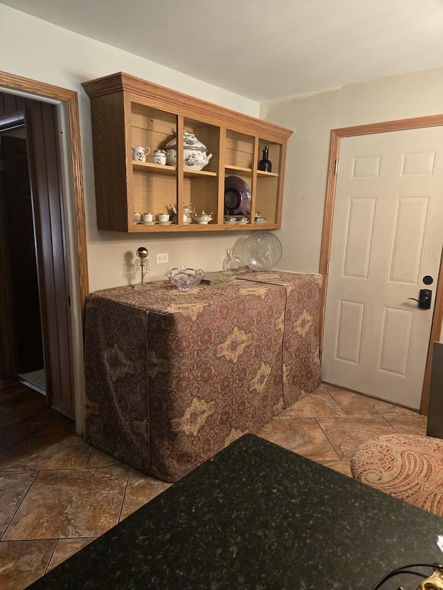 842 Highview Ave, Olympia Fields, IL 60461 - kitchen featuring dark stone counters, open shelves, and stone finish floors