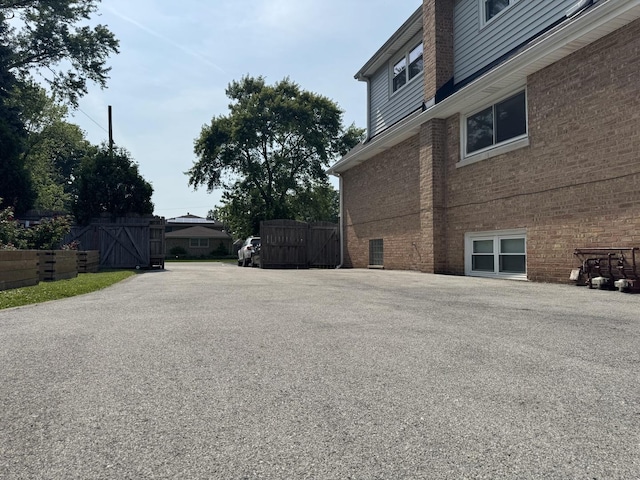 7743 Cronin Ave, Justice, IL 60458 - view of side of home with a gate and brick siding