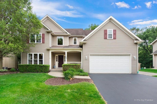 1103 Paul Ct, Fox River Grove, IL 60021 - traditional home featuring driveway, a garage, a front yard, and a porch
