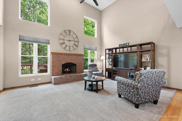 1103 Paul Ct, Fox River Grove, IL 60021 - living area with a high ceiling, a brick fireplace, ceiling fan, and wood finished floors