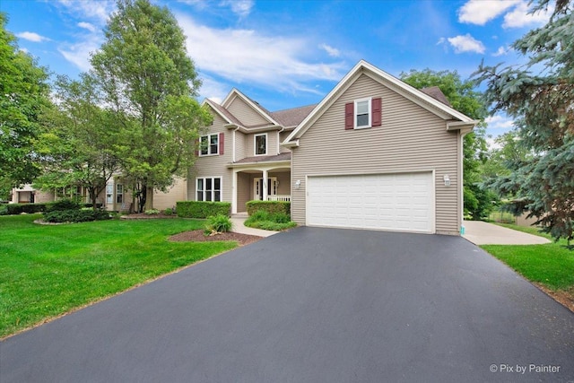 1103 Paul Ct, Fox River Grove, IL 60021 - traditional-style home featuring an attached garage, asphalt driveway, and a front lawn
