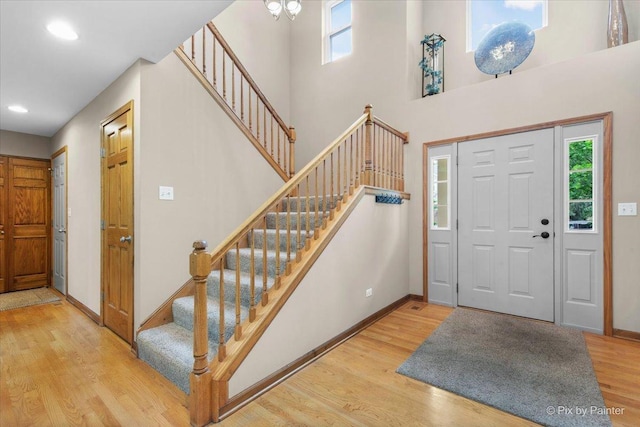 1103 Paul Ct, Fox River Grove, IL 60021 - entryway with wood finished floors, stairs, a towering ceiling, and recessed lighting