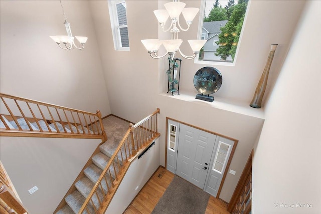 1103 Paul Ct, Fox River Grove, IL 60021 - entrance foyer featuring a chandelier, wood finished floors, and stairs