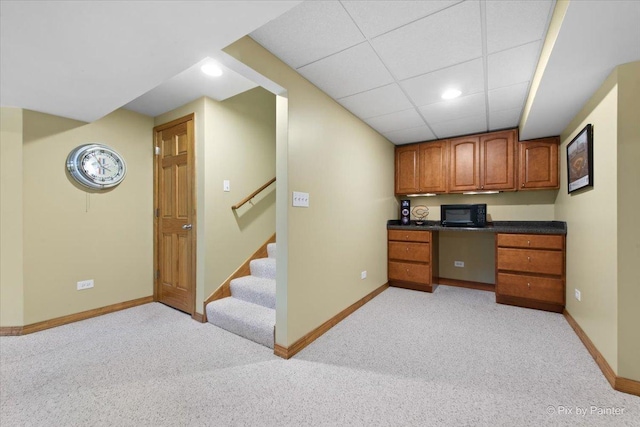 1103 Paul Ct, Fox River Grove, IL 60021 - kitchen with light colored carpet, dark countertops, brown cabinets, recessed lighting, and built in study area
