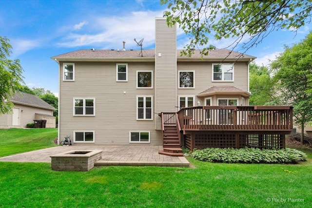 1103 Paul Ct, Fox River Grove, IL 60021 - rear view of house featuring a patio, a wooden deck, a chimney, and a lawn
