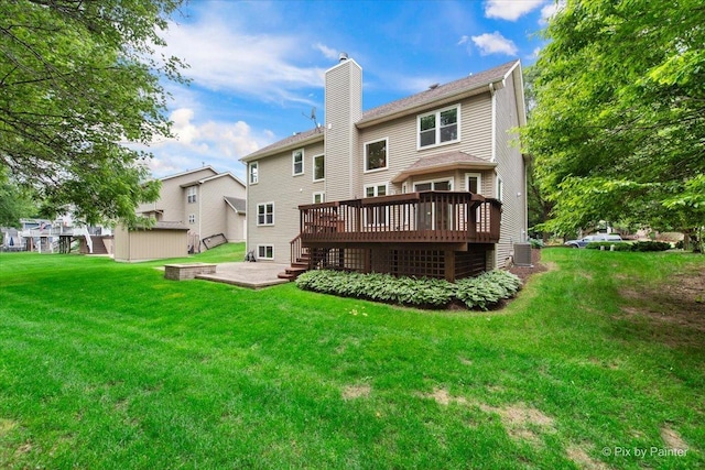 1103 Paul Ct, Fox River Grove, IL 60021 - rear view of property featuring a wooden deck, a chimney, and a lawn