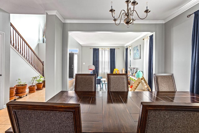184 Primrose Ln, Bartlett, IL 60103 - dining area with a chandelier, crown molding, and stairs