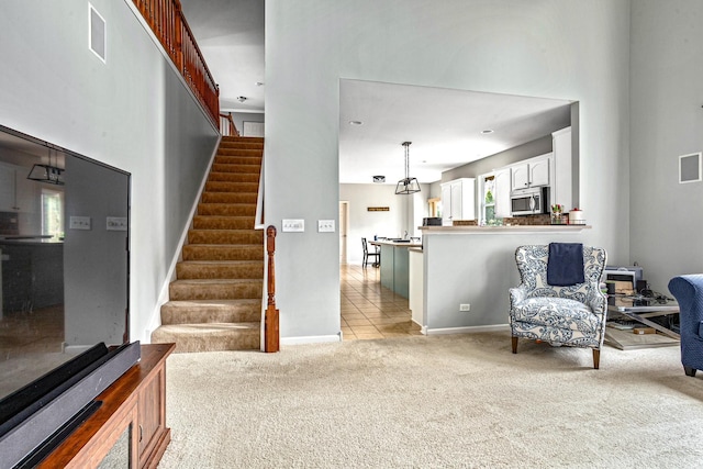184 Primrose Ln, Bartlett, IL 60103 - living area featuring light carpet and stairs