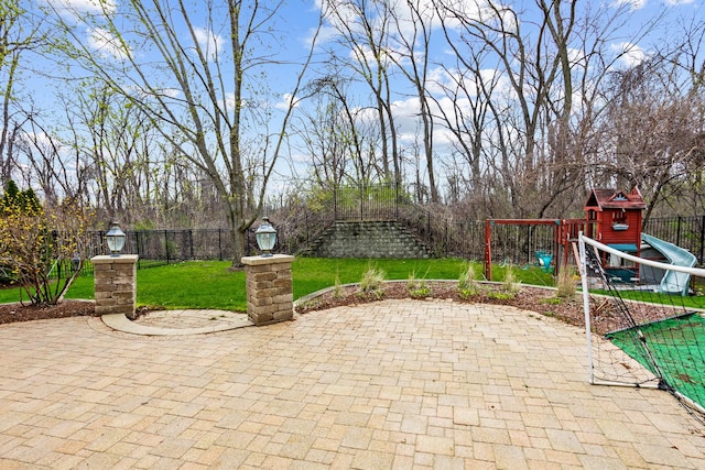 184 Primrose Ln, Bartlett, IL 60103 - fenced backyard featuring a playground and a patio