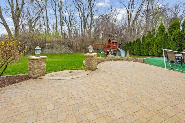 184 Primrose Ln, Bartlett, IL 60103 - view of patio featuring a playground and view of scattered trees