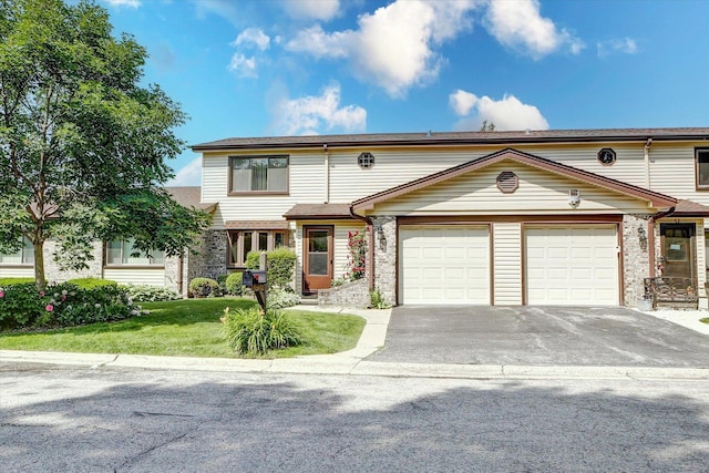 1330 S Mallard Ln, Mount Prospect, IL 60056 - multi unit property with a garage, driveway, a front yard, and brick siding