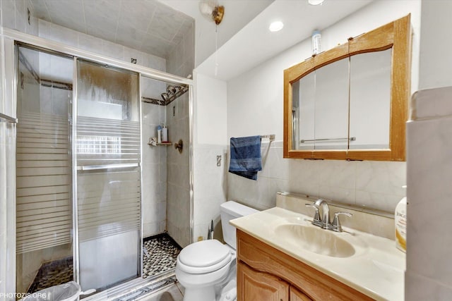 1330 S Mallard Ln, Mount Prospect, IL 60056 - full bathroom with vanity, a stall shower, recessed lighting, and tile walls