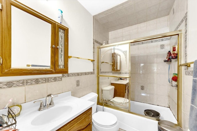 1330 S Mallard Ln, Mount Prospect, IL 60056 - bathroom featuring tile walls, vanity, and enclosed tub / shower combo