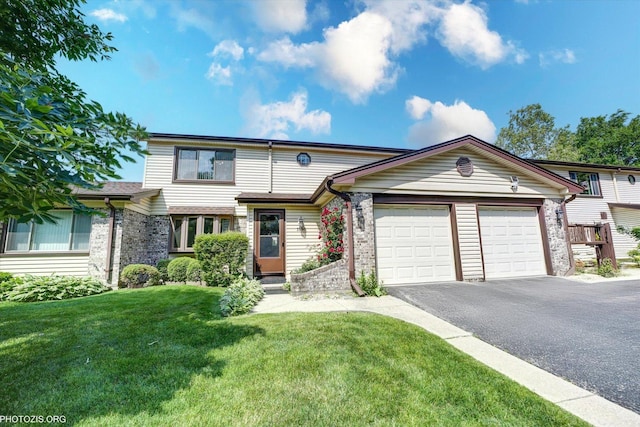 1330 S Mallard Ln, Mount Prospect, IL 60056 - view of front of house with an attached garage, asphalt driveway, a front yard, and brick siding