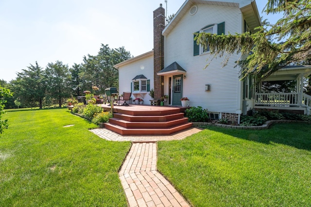 1392 Red Brick Rd, Dixon, IL 61021 - back of house featuring a deck, a yard, and a chimney