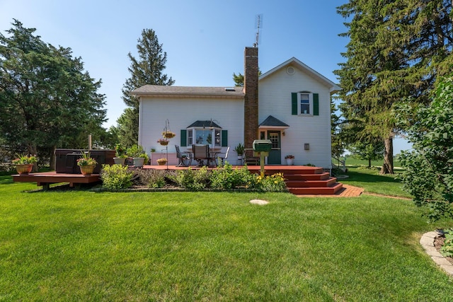 1392 Red Brick Rd, Dixon, IL 61021 - back of house featuring a wooden deck, a chimney, and a yard