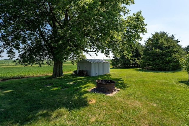 1392 Red Brick Rd, Dixon, IL 61021 - view of grassy yard featuring an outdoor structure and an outdoor fire pit