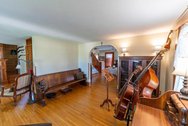 1392 Red Brick Rd, Dixon, IL 61021 - living area with arched walkways, hardwood / wood-style flooring, and a textured ceiling