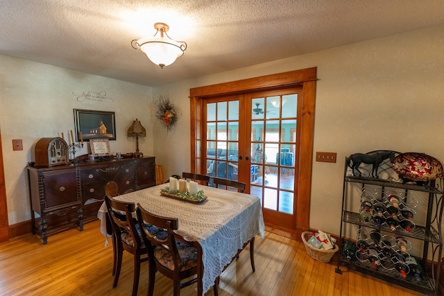 1392 Red Brick Rd, Dixon, IL 61021 - dining room featuring french doors, hardwood / wood-style floors, and a textured ceiling