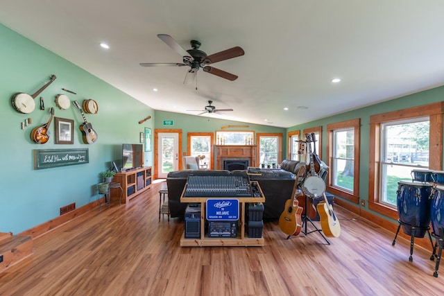 1392 Red Brick Rd, Dixon, IL 61021 - living area with wood finished floors, a fireplace, plenty of natural light, vaulted ceiling, and a ceiling fan