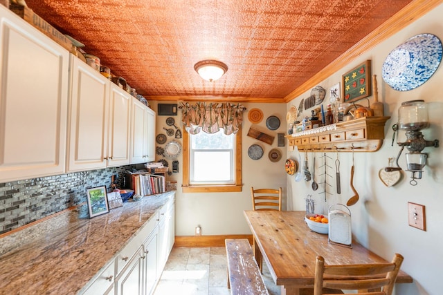 1392 Red Brick Rd, Dixon, IL 61021 - kitchen featuring ornamental molding, tasteful backsplash, and white cabinets