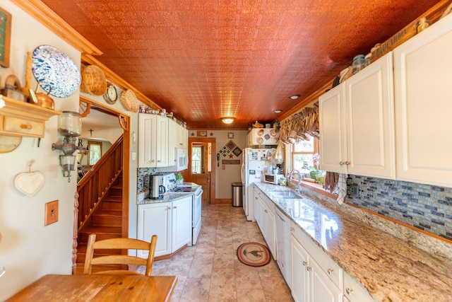 1392 Red Brick Rd, Dixon, IL 61021 - kitchen featuring white electric range, backsplash, white cabinets, dishwasher, and light stone countertops