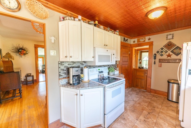 1392 Red Brick Rd, Dixon, IL 61021 - kitchen with white appliances, white cabinetry, light countertops, crown molding, and backsplash