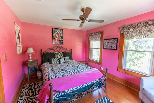1392 Red Brick Rd, Dixon, IL 61021 - bedroom featuring multiple windows, wood finished floors, and ceiling fan