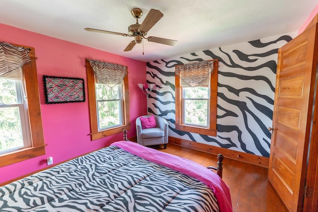1392 Red Brick Rd, Dixon, IL 61021 - bedroom with multiple windows, hardwood / wood-style floors, and a ceiling fan