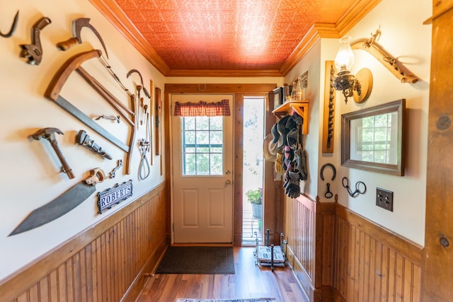 1392 Red Brick Rd, Dixon, IL 61021 - doorway with crown molding, a wainscoted wall, dark wood-style flooring, wooden walls, and an ornate ceiling