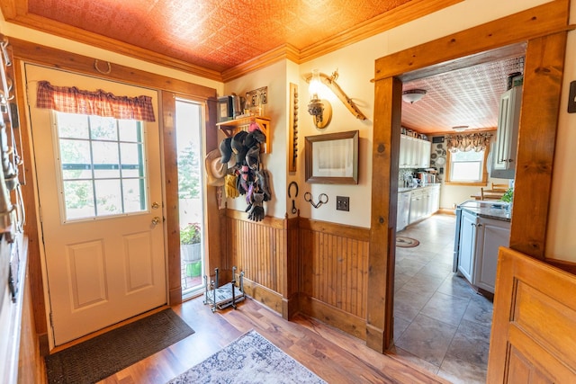 1392 Red Brick Rd, Dixon, IL 61021 - foyer entrance with ornamental molding, plenty of natural light, an ornate ceiling, wood finished floors, and wainscoting