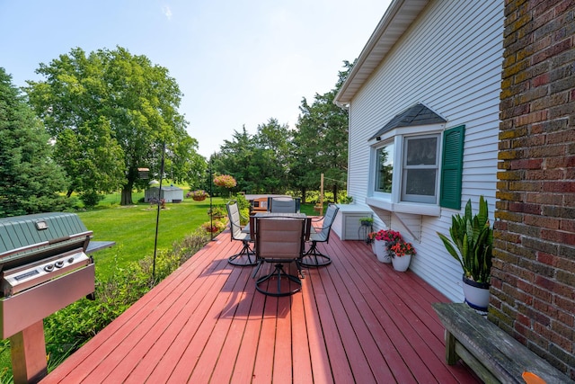 1392 Red Brick Rd, Dixon, IL 61021 - deck featuring a lawn, outdoor dining area, and area for grilling