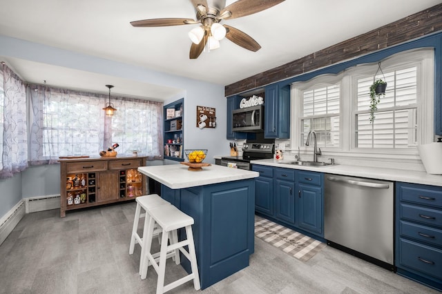 1050 N 8th St, Rochelle, IL 61068 - kitchen featuring stainless steel appliances, blue cabinets, light wood-type flooring, and plenty of natural light