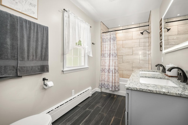 1050 N 8th St, Rochelle, IL 61068 - bathroom with baseboard heating, vanity, shower / tub combo, wood finish floors, and recessed lighting
