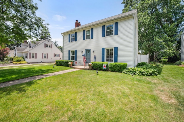1050 N 8th St, Rochelle, IL 61068 - colonial inspired home with a chimney and a front lawn