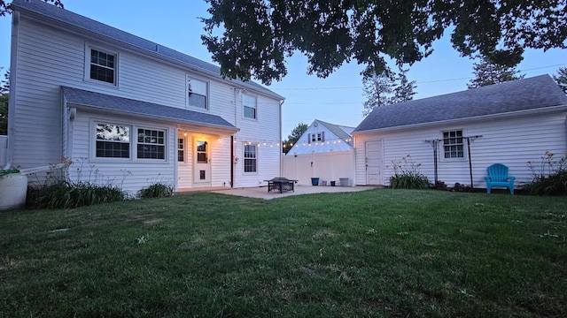 1050 N 8th St, Rochelle, IL 61068 - back of property featuring a yard and a patio area