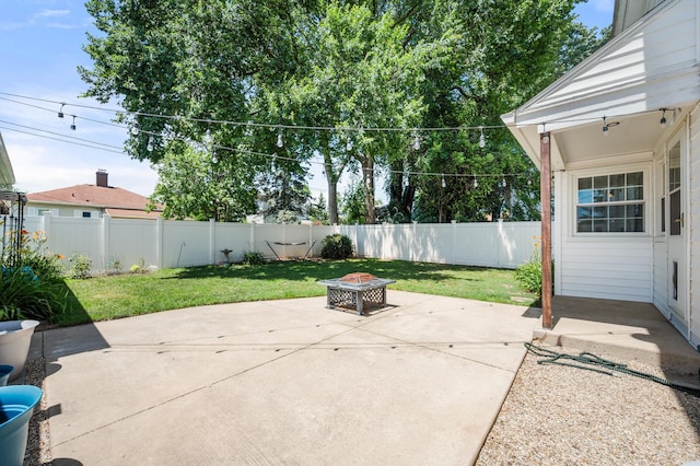 1050 N 8th St, Rochelle, IL 61068 - fenced backyard with a fire pit and a patio area